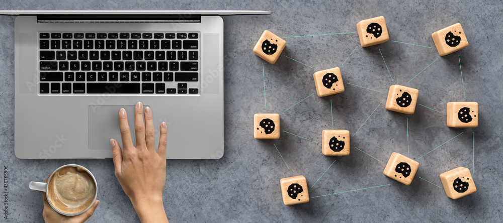Wall mural dice with cookie icons and a laptop conceptual of the gdpr regulations introduced by the eu governin