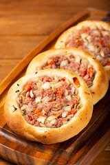 Arabic meat sfiha on the table.