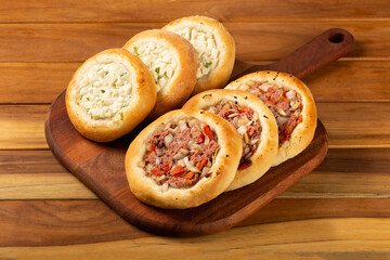Arabic meat and cheese sfiha on the table.
