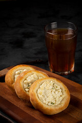 Arabic cheese sfiha on the table.