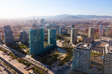 Aerial panoramic view of Barcelona modern neighborhood of Diagonal Mar i el Front Maritim del Poblenou on Mediterranean coast, Spain..