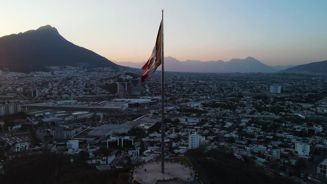 Drone Circular Shot from Mexican Flag in Monterrey Mexico sunset