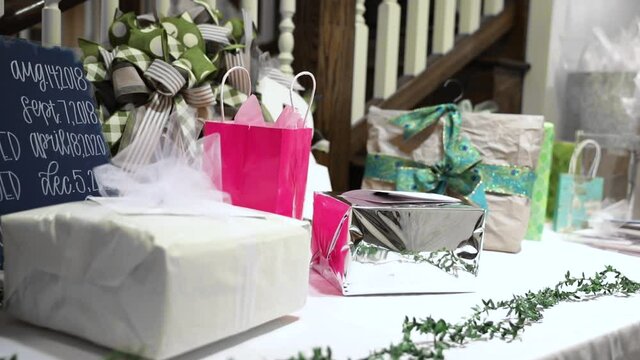 Wrapped Gifts and Presents on Table Display at Wedding Reception Party