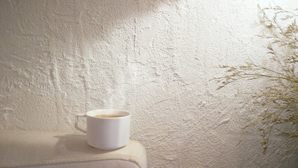 Obraz na płótnie Canvas Hot coffee and tea cup on the relaxing sofa .Background mortar white wall