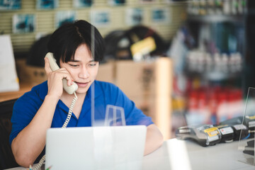 operator worker person using telephone and headset to calling, communication service support in business office phone center, work with computer about telemarketing technology