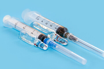 Vaccine. Medical ampoules and syringe for injection.