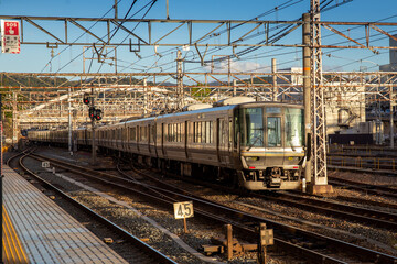 Railway station with modern commuter train in Japan 