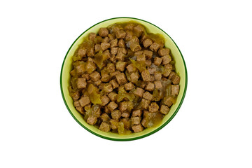 Canned food for cats or dogs in ceramic green bowl isolated on white background. Top view