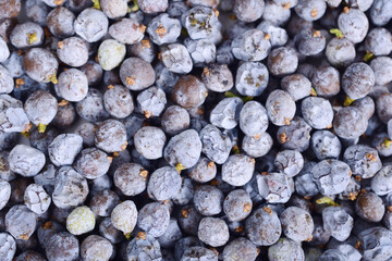 Juniper Berry Cone Top View Background (Juniperus Communis). Dried Herb and Medicinal Raw Material.