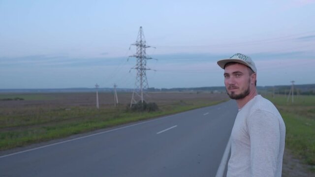 Impudent Man Stands Near the Road and Spits Saliva, Angry Man Waiting for Taxi. Slow Spit