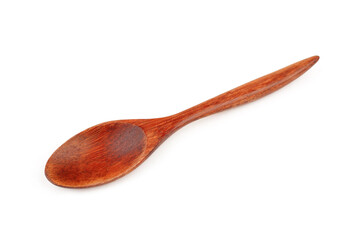 Brown wooden spoon on white background, selective focus