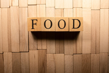 The word food was created from wooden cubes. Close up.