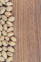 Pistachio nuts containing vitamins and minerals. Healthy eating. Place for text