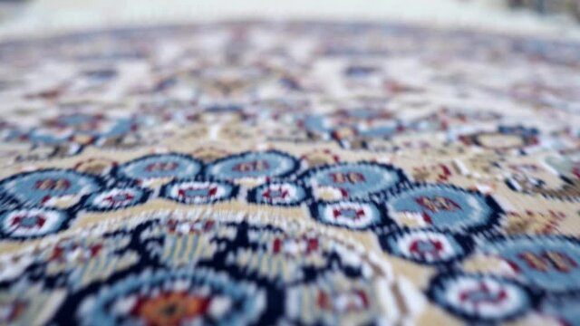 Close-up of beautiful multicolored carpet with patterns camera movement.