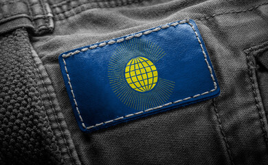 Tag on dark clothing in the form of the flag of the Commonwealth