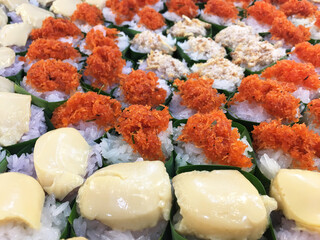 Thai desserts coconut custard, Shrimp, Fuzz, Sweet coconut on Sticky rice on green banana leaf