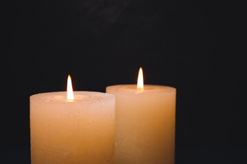 Burning candles on dark background