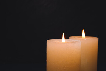 Burning candles on dark background