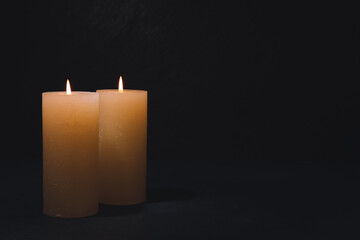 Burning candles on dark background