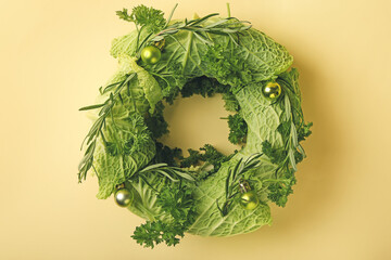 Christmas wreath made of fresh vegetables on color background © Pixel-Shot