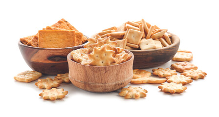 Bowls with tasty different crackers on white background