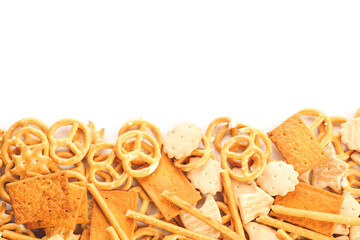 Tasty different crackers on white background