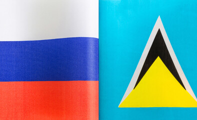 fragments of the national flags of Russia and Saint Lucia close-up