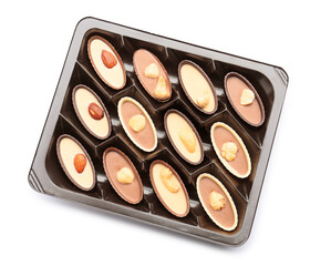 Box with tasty chocolate candies on white background