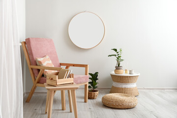 Stylish interior with modern armchair and mirror