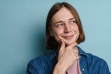 Young european man smiling and looking aside