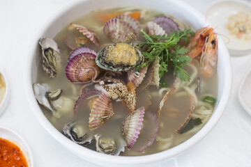 Korean noodle Soup with Various fresh seafood.