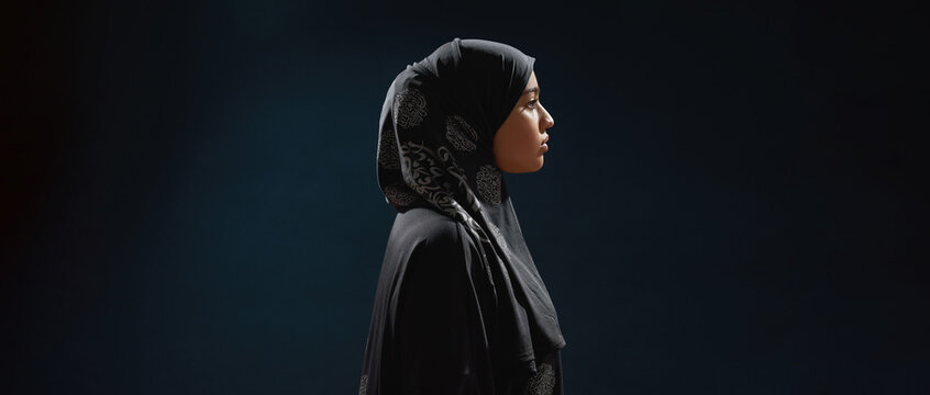 Profile Of Young Arabian Woman In Hijab Standing Sideways