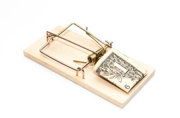 Mousetrap with dollar bill as a bait