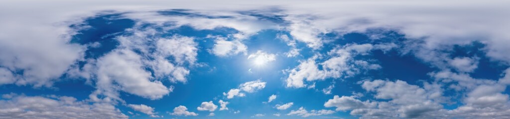 Obraz premium Blue sky panorama with Cirrus clouds in Seamless spherical equirectangular format. Full zenith for use in 3D graphics, game and editing aerial drone 360 degree panoramas for sky replacement.