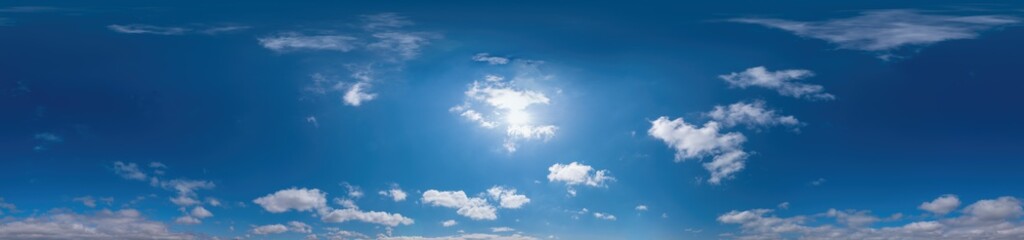 Blue sky panorama with Cirrus clouds in Seamless spherical equirectangular format. Full zenith for use in 3D graphics, game and editing aerial drone 360 degree panoramas for sky replacement.