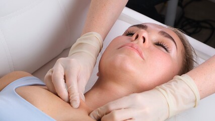Obraz na płótnie Canvas Skincare - woman cleavage massage at salon.