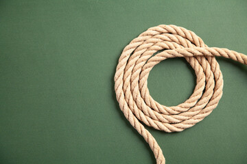 Brown rope on green background.