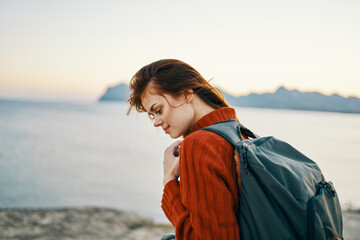 happy woman travel tourism backpack ocean mountains sea