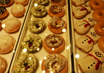 Assorted Donuts displayed in display cabinet