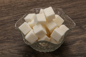Refined white sugar cubs in the bowl