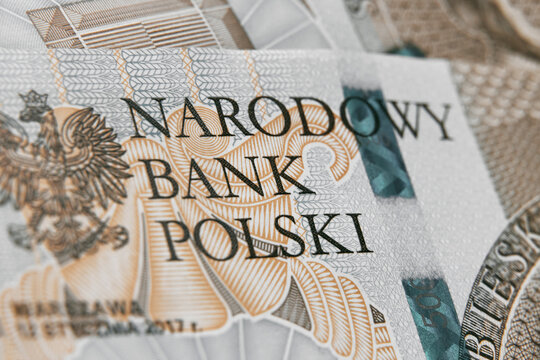 Close up on national polish bank of new Polish banknotes five hundred zloty. Macro photo of narodowy bank polski sign on PLN bill. Shallow focus. Close-up with fine and sharp texture © AlexGo