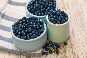 Frech blueberries on white wooden board background. Healthy eating