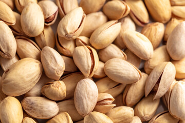 Close-up of fresh pistachio nuts as background.