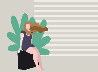 Woman sitting on top of a suitcase