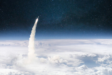 Rocket lift off through the clouds and flies into outer deep space. Spaceship successful launch....