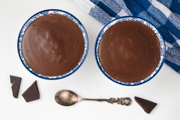 Chocolate pudding in bowl. Homemade chocolate dessert.