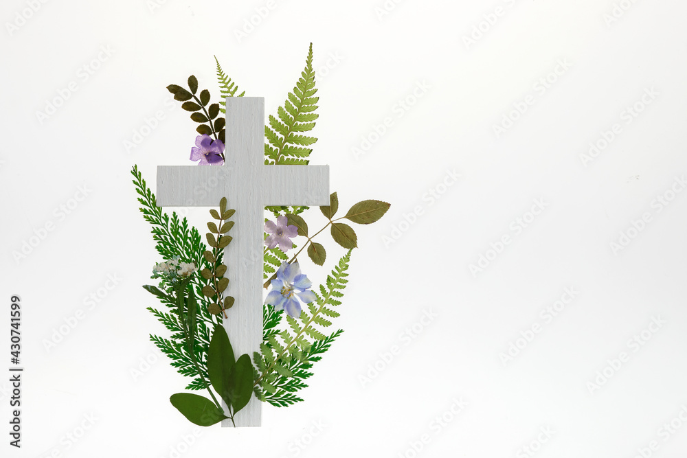 Wall mural the christianity cross of green leaves. baptism, easter, church holiday background