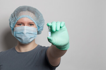 Covid-19 vaccine in healthcare worker hand on white background. Medicine, COVID-19 and vaccination concept