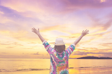women hand up and sea sunset background