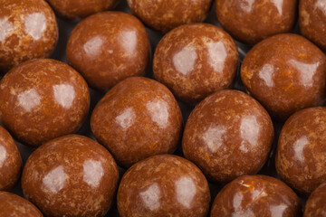 Close up of chocolate candy balls. Confectionery textered background